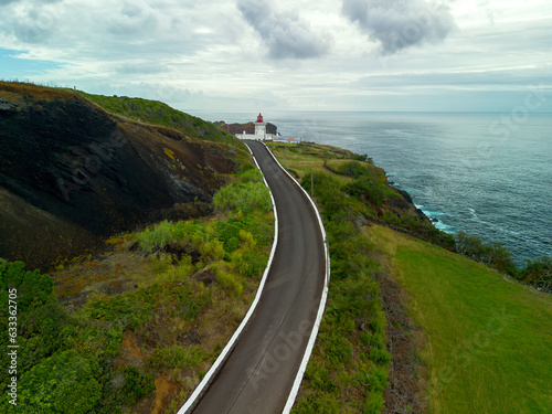 Estrada para o Farol das Contendas na linha de costa da Ilha Terceira nos Açores  photo