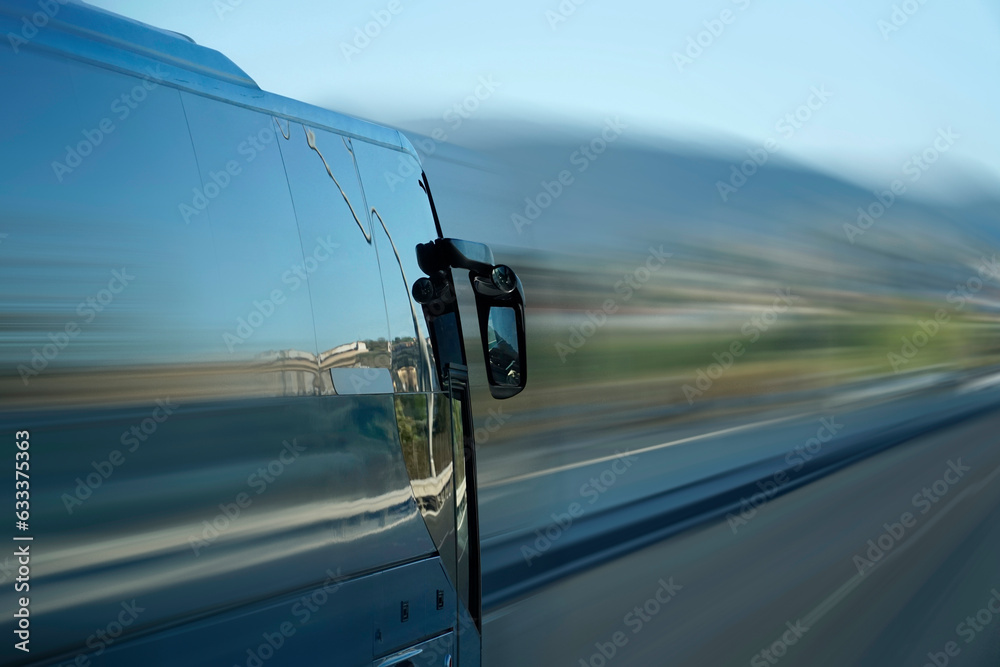 Tourist bus on a highway, motion blur effect - side view