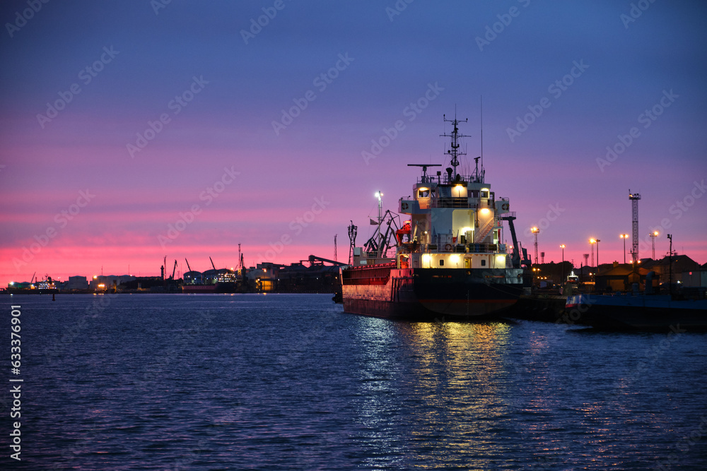 View of the port and ships against the sunset sky