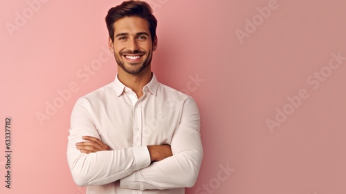 Confident handsome man with arms crossed over body smiling and looking determined. 