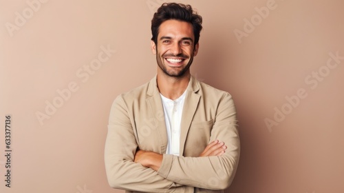 Confident handsome man with arms crossed over body smiling and looking determined. 