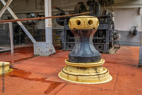 capstan and other gear on a deck of a vintage sidewheeler river dredge