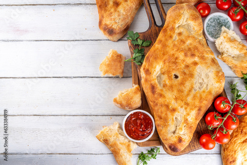 Shotis puri, handmade Georgian bread lavash, local national Caucasian Central Asian food, fresh baked Shoti bread photo