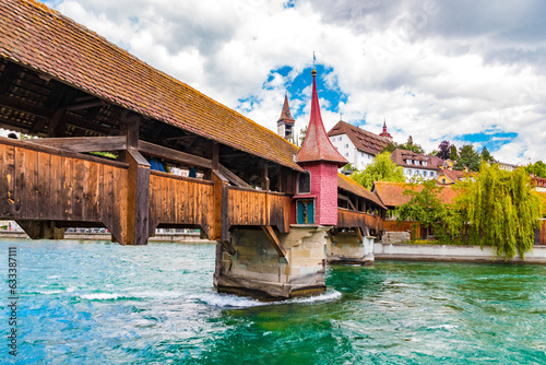 Lovely view of the south wing of Lucerne's famous Spreuer Bridge with the bridge chapel. It got its name because the chaff from the nearby city mills was poured over the bridge into the Reuss river.
