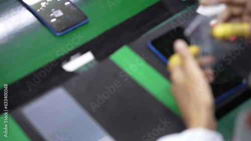 labor working in martphone production assembly line photo