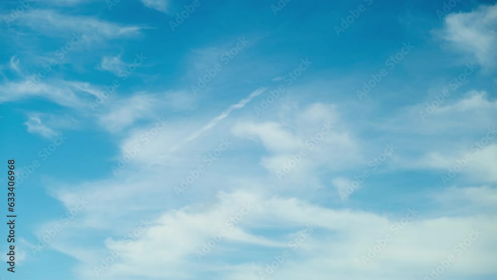 The fluffy white clouds against the blue sky created a classic and timeless view of nature, timelapse