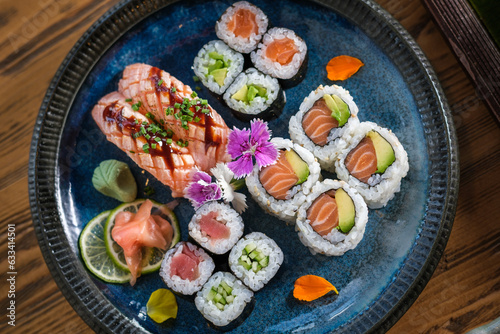 Plate with assorted sushi served with wasabi and ginger