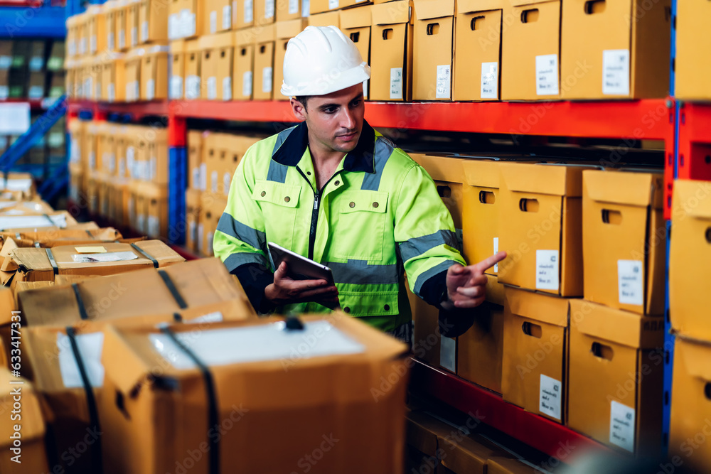 Warehouse worker working in warehouse storage. Foreman or worker work at factory site check up products in site. Inventory worker working in factory Storehouse Warehouse worker working in warehouse storage. Foreman or worker work at factory site check up products in site. Inventory worker working in factory Storehouse