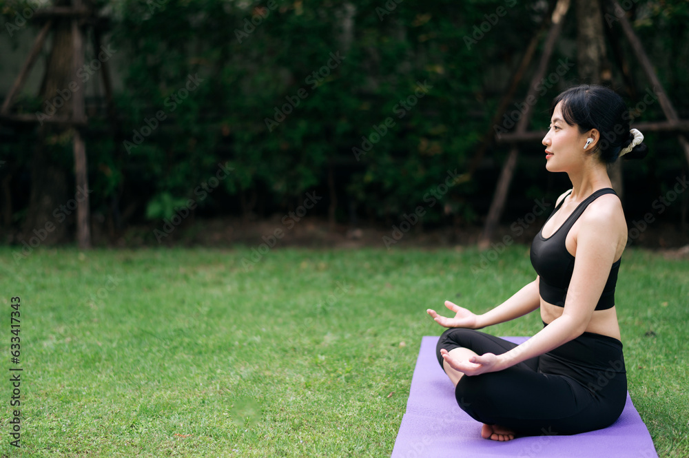 Forest Yoga Flow. Amidst lush greens, asian woman in her 30s wearing sportswear blends nature and practice, embracing wellness, relaxation, and vitality. Forest Yoga Flow. Amidst lush greens, asian woman in her 30s wearing sportswear blends nature and practice, embracing wellness, relaxation, and vitality.