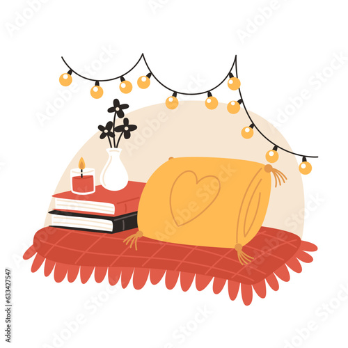Cozy corner with pillow, books, scented candle and garland in your room