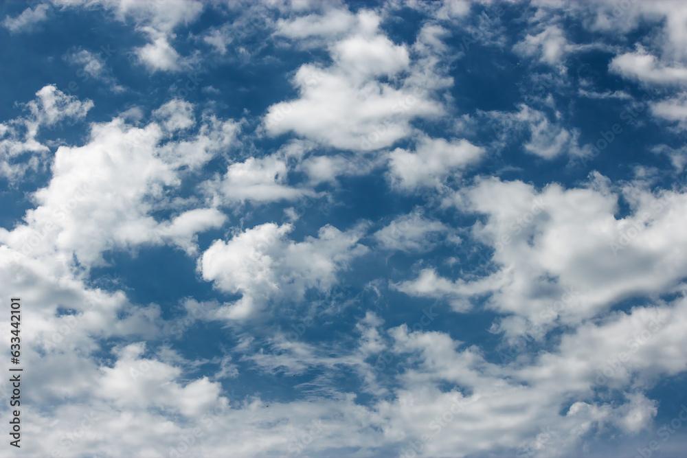 A blue sky with white clouds. The sky is a deep blue color, and it is clear except for the clouds. The clouds are white and fluffy, and they add a sense of beauty and tranquility to the photo A blue sky with white clouds. The sky is a deep blue color, and it is clear except for the clouds. The clouds are white and fluffy, and they add a sense of beauty and tranquility to the photo