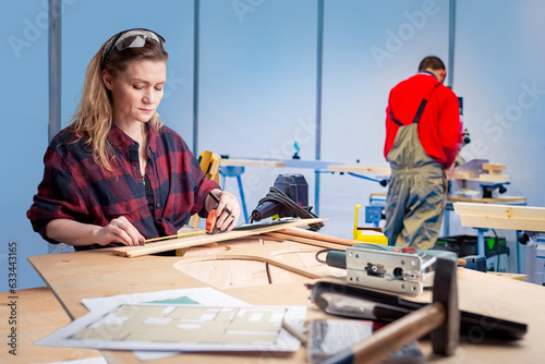 Woman works as carpenter. G...