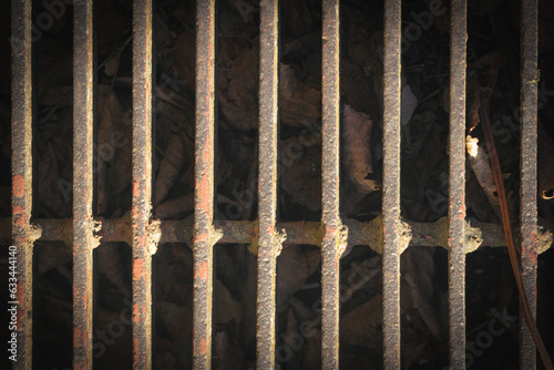 Eleven old rusty, horizontally placed metal grates