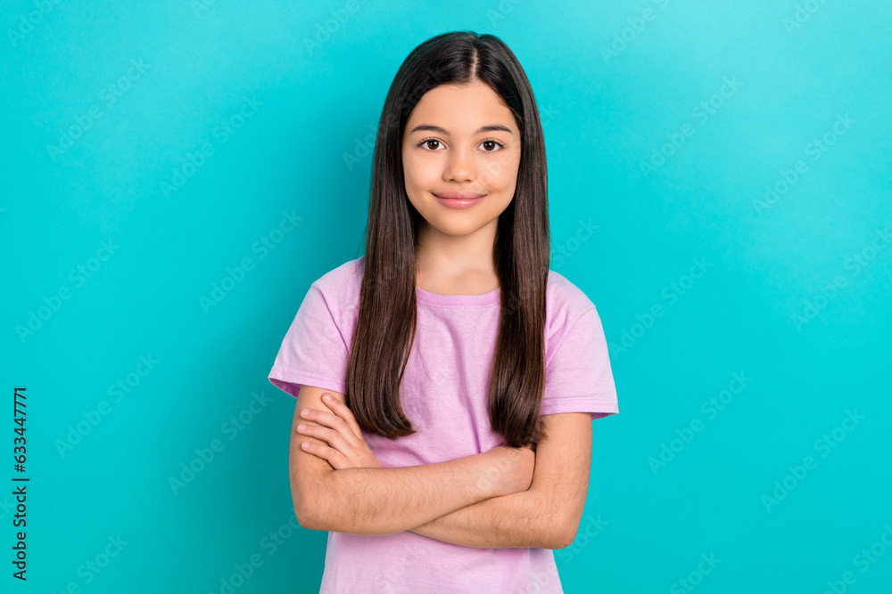 Photo of cheerful good mood small kid wear pink t-shirt arms crossed smiling isolated turquoise color background Photo of cheerful good mood small kid wear pink t-shirt arms crossed smiling isolated turquoise color background