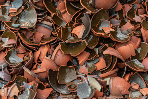 Fragments of cups containing rubber tree latex outside the traditional pottery village in Tay Ninh city, Vietnam