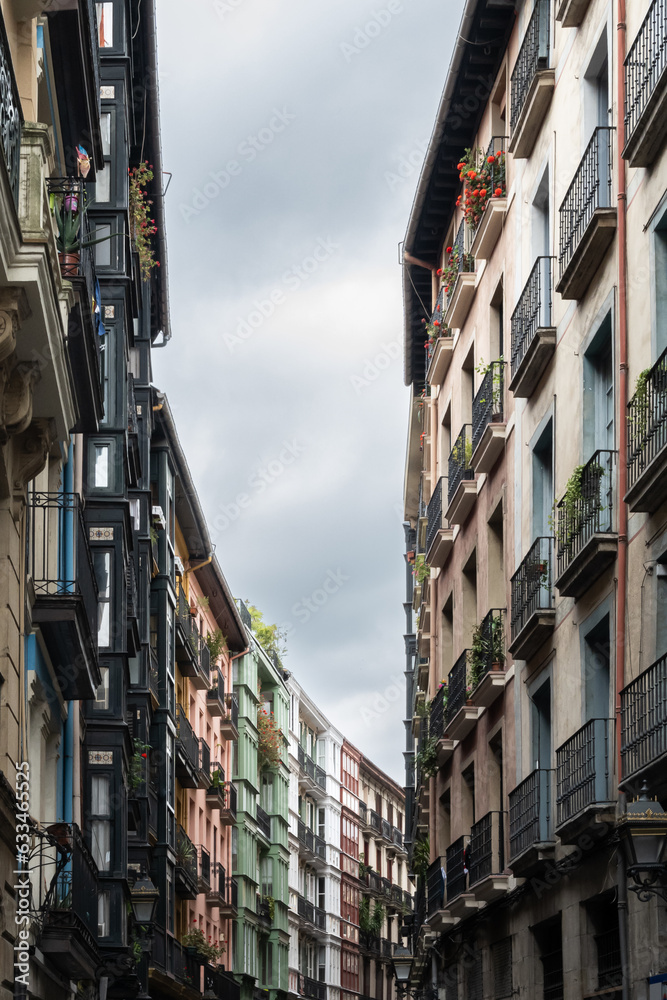 Obraz premium Apartments buildings lining street of Bilbao old town in Spain