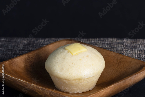 Cheese Puto is a delicious Filipino steamed cake usually eaten as a snack or dessert. Copy space 