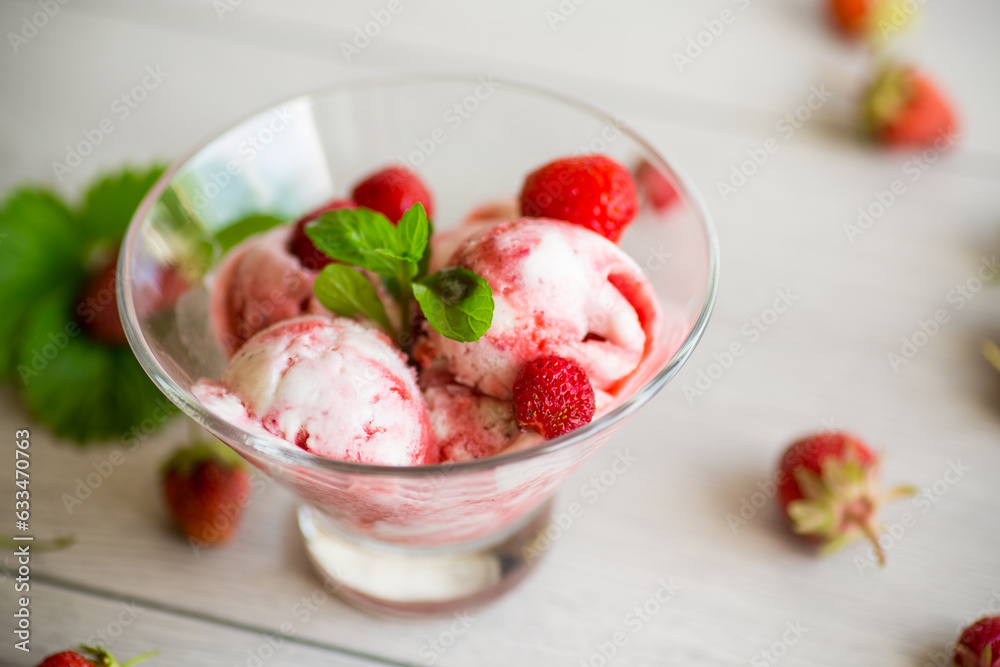 Balls of homemade strawberry ice cream in a bowl Balls of homemade strawberry ice cream in a bowl