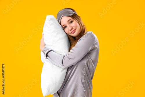 Young woman in pajamas with...