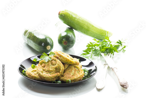 Fried squash green pancakes in a plate.