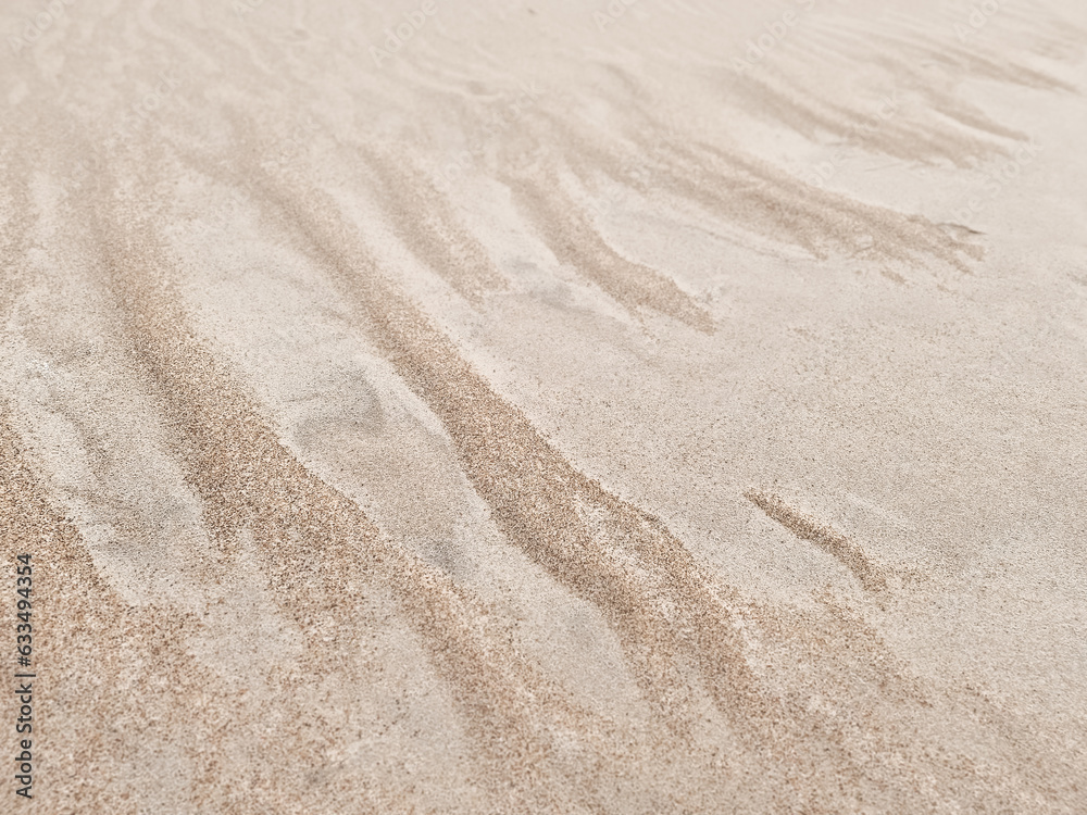 Sand texture. Sandy beach for background. Top view. Natural sand stone texture background. sand on the beach as background. Wavy sand background for summer designs. Sand texture. Sandy beach for background. Top view. Natural sand stone texture background. sand on the beach as background. Wavy sand background for summer designs.