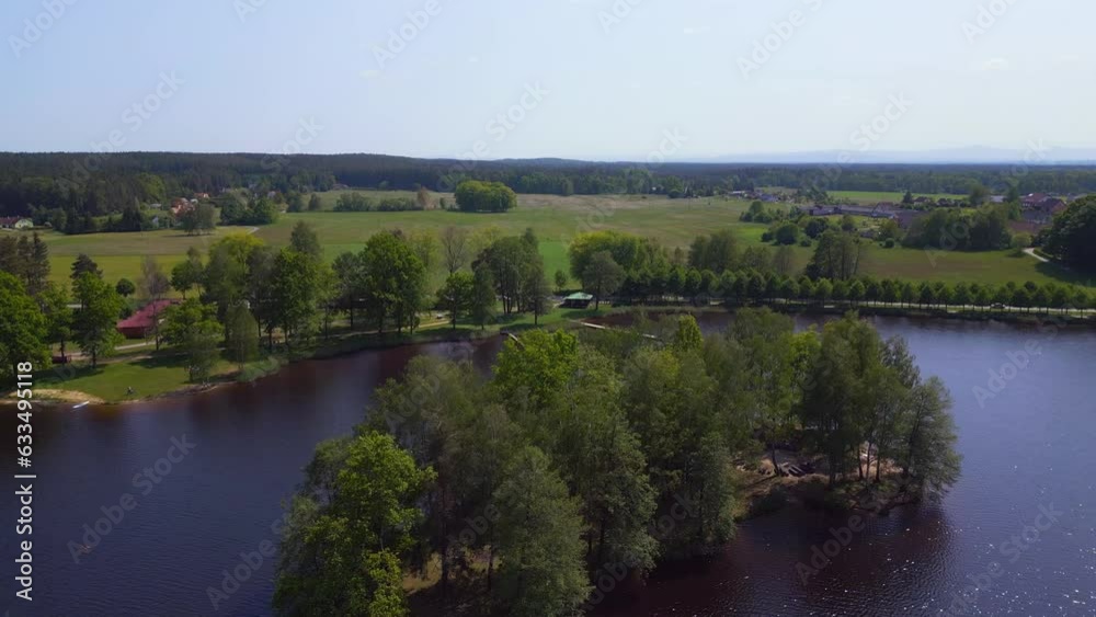 Dramatic aerial top view flight drone. Summer Paradise Wooded Island in Lake Dramatic aerial top view flight drone. Summer Paradise Wooded Island in Lake