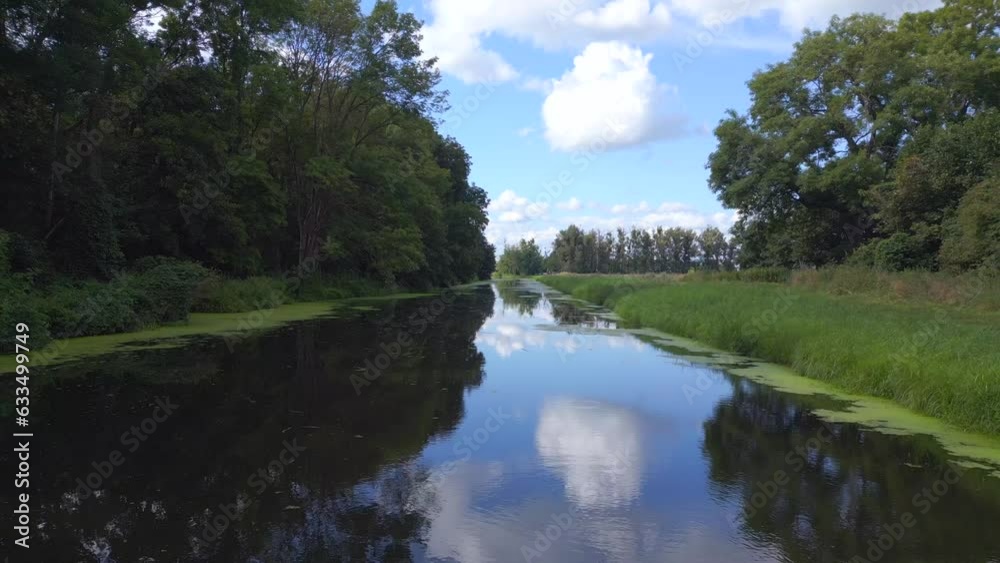 Best aerial top view flightdrone. Sport paddle boat on natural German River Best aerial top view flightdrone. Sport paddle boat on natural German River