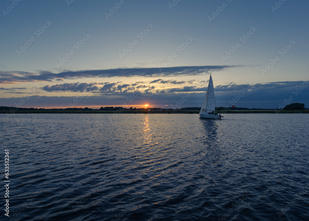 A sailing boat during sunset