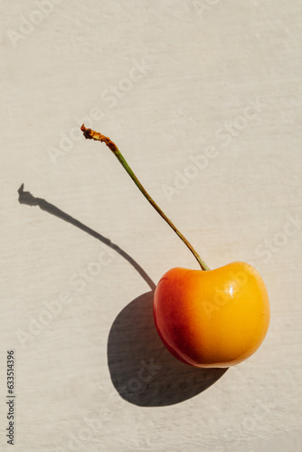close up of yellow and red Rainier cherry photo