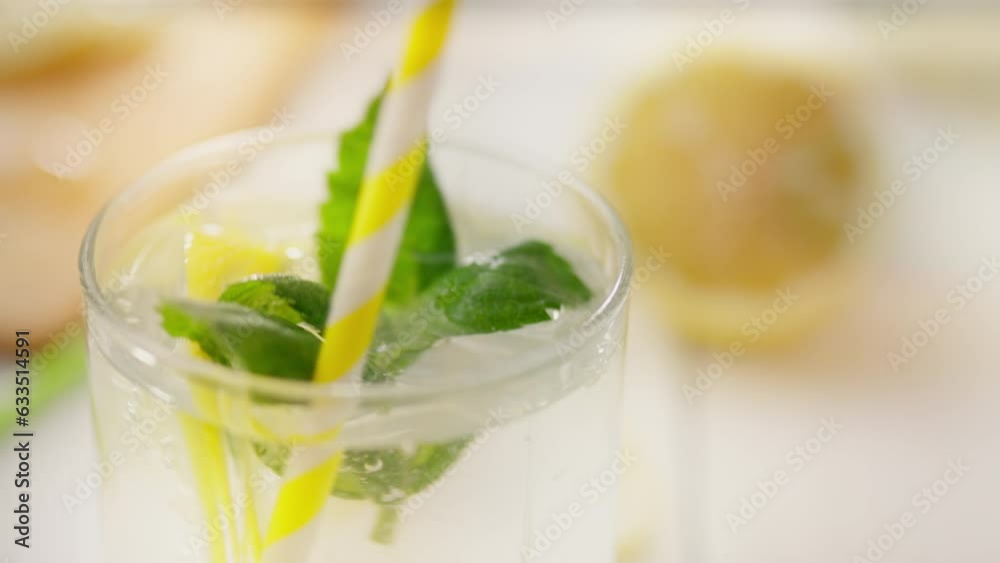 Lemonade, stay-at-home parent focused on creating a refreshing lemon mojito in the kitchen. Cinematic trailing shot european woman cooking citrus mojito new salad recipes, lime Lemonade, stay-at-home parent focused on creating a refreshing lemon mojito in the kitchen. Cinematic trailing shot european woman cooking citrus mojito new salad recipes, lime