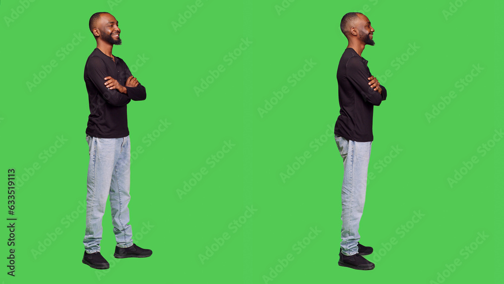 African american person smiling in studio and posing, wearing shirt and jeans over full body green screen background. Young adult feeling confident and positive, casual male model. African american person smiling in studio and posing, wearing shirt and jeans over full body green screen background. Young adult feeling confident and positive, casual male model.