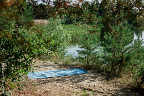 Yoga mat in the park on the background of the river