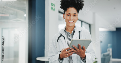 Face of happy woman doctor on tablet for medical research, hospital management and telehealth service. Portrait of young black person in professional healthcare career, job or clinic on digital tech