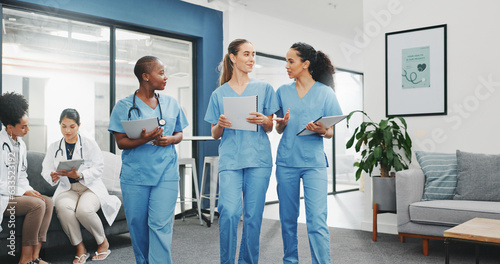 Talking nurses, walking and documents in hospital teamwork, diversity collaboration or bonding on surgery or clinic break. Smile, happy and healthcare women with medical research, paper or funny joke
