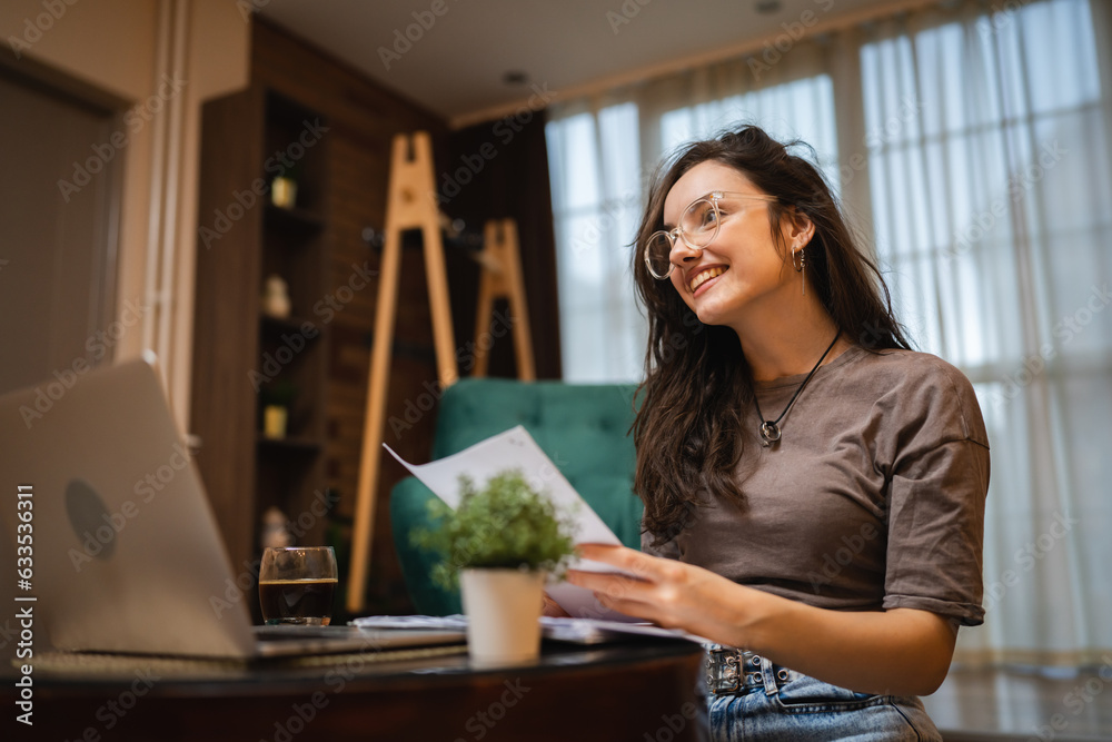 One woman young caucasian female student study and read at home One woman young caucasian female student study and read at home
