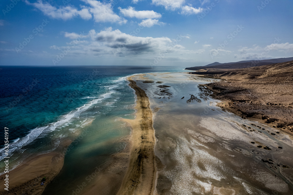 Landscape of Fuerteventura from drone, Yellow, sandy beach and blue water of atlantic ocean