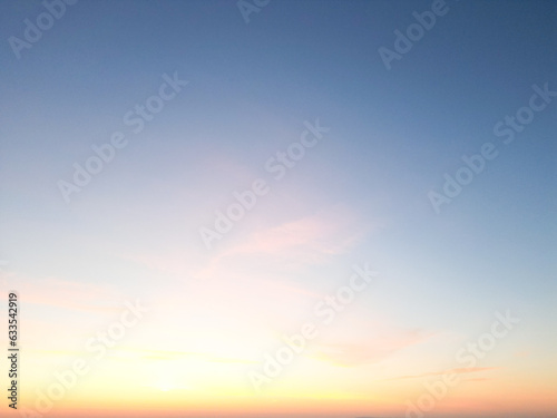 Amidst a serene backdrop, the dawn breaks, painting the horizon in myriad shades of pink. A drone captures this breathtaking ballet of nature from a bird's-eye perspective, 