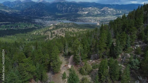 Aerial of mountain bikers traversing a high mountain trail in Colorado photo