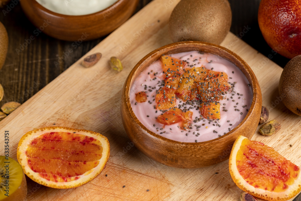 fresh yogurt with berries and fruits with red oranges fresh yogurt with berries and fruits with red oranges