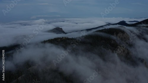 Fog rolls over the mountain peaks in Colorado