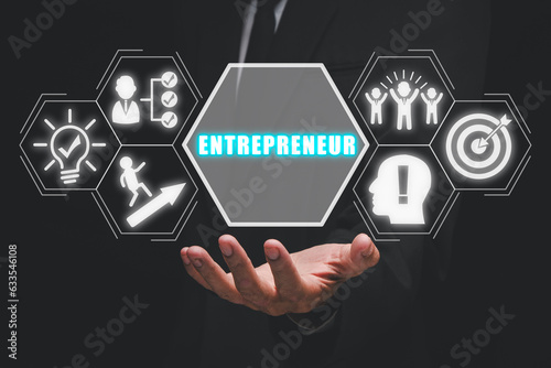 Entrepreneur concept, Business person hand holding entrepreneur icon on virtual screen.