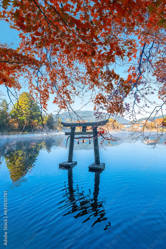 Yufuin, Japan - Nov 27 2022: Tenso-jinja shrine at lake Kinrin, is one of the representative sightseeing spots in the Yufuin area at the foot of Mount Yufu. - obrazy, fototapety, plakaty 