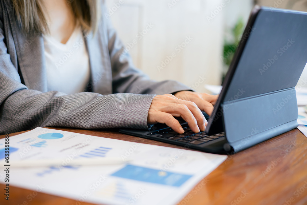 Asian Business woman discussion and analysis data at office Asian Business woman discussion and analysis data at office