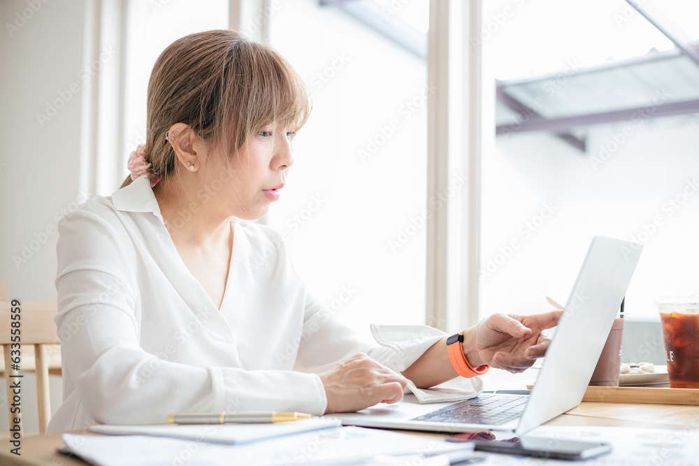 Asian Business woman discussion and analysis data at office Asian Business woman discussion and analysis data at office
