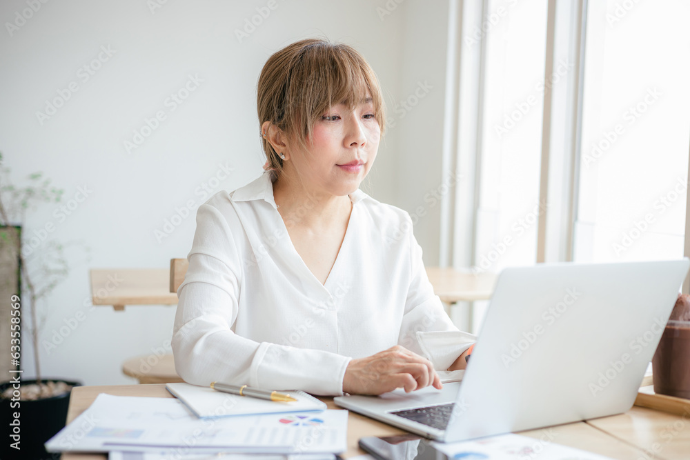 Asian Business woman discussion and analysis data at office Asian Business woman discussion and analysis data at office