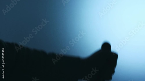 shadow of a hand killing with a knife photo