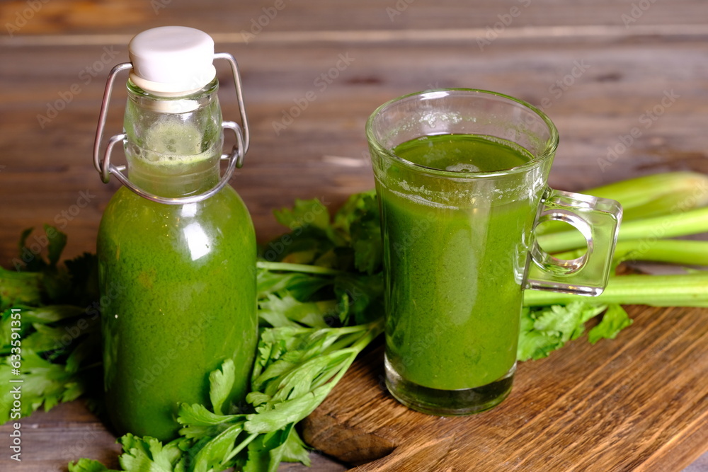 celery juice in clear glasses and bottles. Celery is a leaf vegetable and medicinal plant commonly used as a cooking spice. This juice has health benefits, diet drinks and health drinks. Celery. celery juice in clear glasses and bottles. Celery is a leaf vegetable and medicinal plant commonly used as a cooking spice. This juice has health benefits, diet drinks and health drinks. Celery.