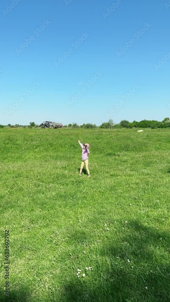 happy family playing frisbee at green field happy family playing frisbee at green field