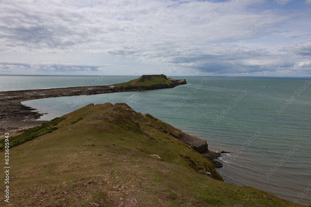 Summer landscape of Worm s Head and Rhosilli Bay in Wales