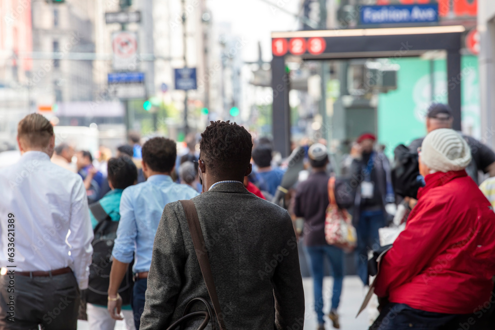 Fototapeta premium USA, New York, Manhattan downtown. Crowded with busy people who walk in hurry, blur background.